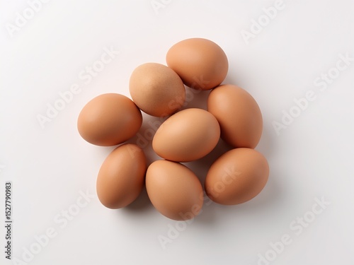 Brown eggs in a simple pattern on white, embodying minimalism and natural elegance.