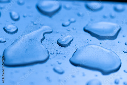 A blue surface with water droplets on it
