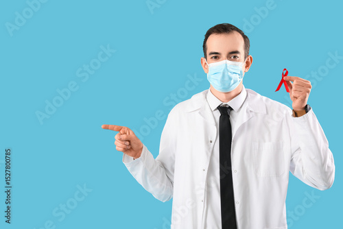 Young male doctor with face...