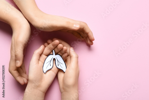 Hands of woman and child wi...