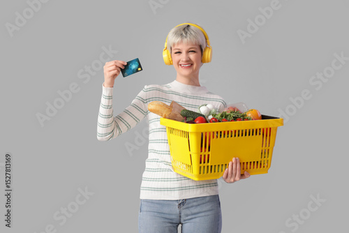 Young woman in headphones w...