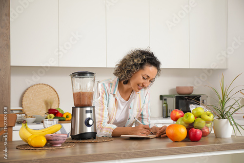 Mature woman with notebook ...