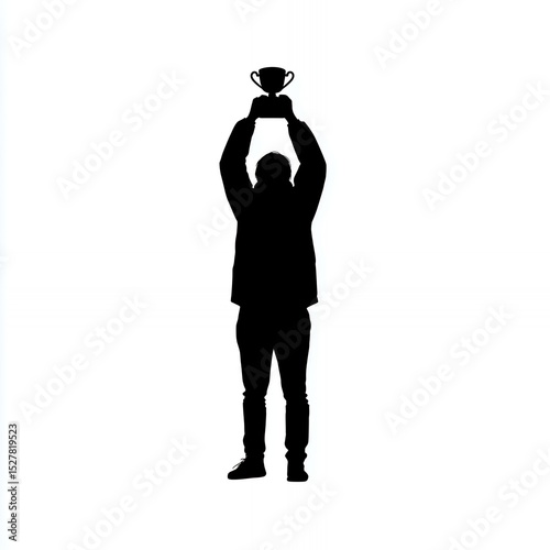 A man is holding a trophy in his hand. The trophy is in the shape of a cup