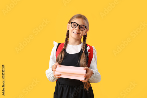 Cute schoolgirl with books ...