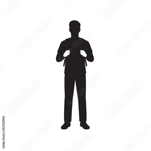 Silhouette of man standing with backpack holding both straps