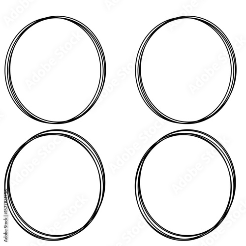 Four black striped circles on a white surface