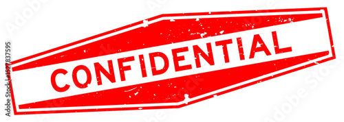 Grunge red confidential word hexagon rubber seal stamp on white background