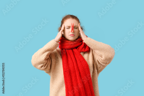 Ill young woman with clothe...