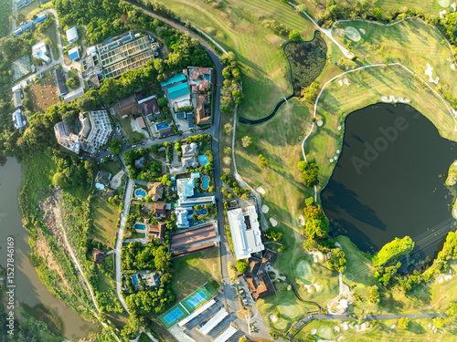 Aerial view drone shot of beautiful green golf field fairway and putting green,Top down image for sport background and travel nature background.