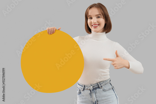 Young woman pointing at bit...
