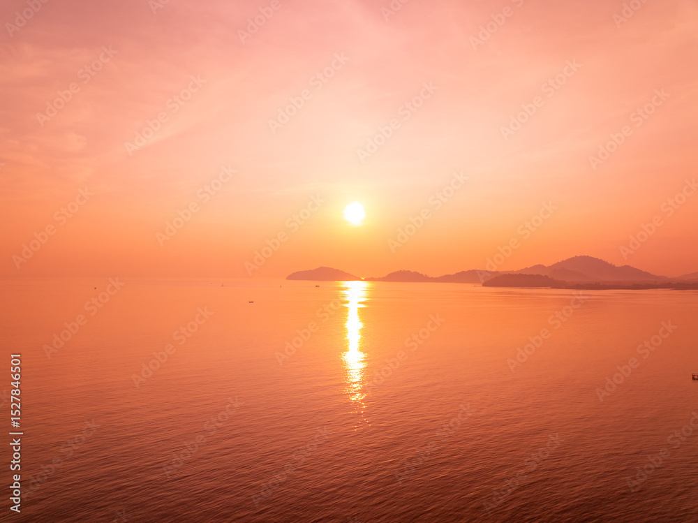 Fototapeta premium Aerial view sunset sky,Nature beautiful light Sunset or sunrise over sea,Colorful scenery sunset sky background,Amazing clouds and waves in sunrise sky nature light cloud background.