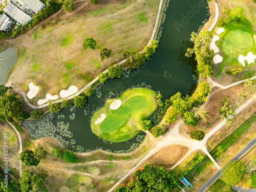 Aerial view drone shot of beautiful green golf field fairway and putting green,Top down image for sport background and travel nature background.