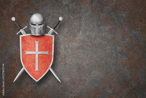 knight's helmet shield and two swords on grunge background