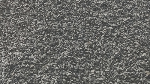 Dark gray gravel stones texture background