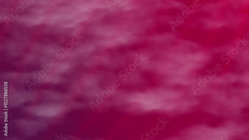 Soft gradient background blending solid red pink and purple hues in a cloudy, fluid pattern, creating a visually appealing abstract backdrop.
