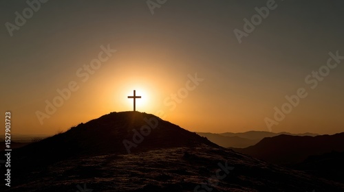 A silhouette of a cross on a hilltop, with the sun setting behind it, implying the sacrificial death of Jesus and his resurrection, as believed in the Christian faith.