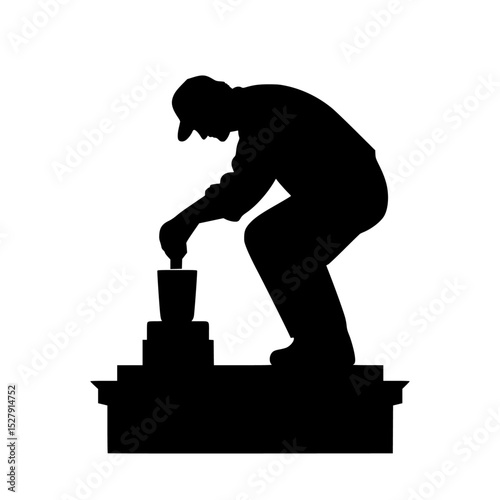 a silhouette of a man squatting on top of a cement block black, man, silhouette
