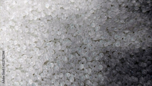 Obraz na płótnie Close-Up of Clear Plastic Pellets – Raw Polymer Granules for Industrial Use