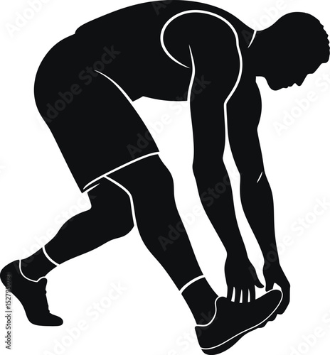 A silhouette of a male athlete in a starting position preparing for a race or workout session indoors