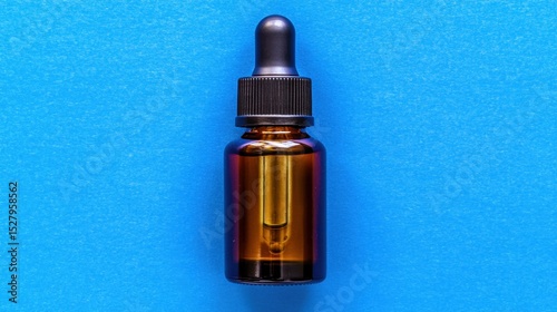 Aromatic Potion: A sleek, amber-colored glass bottle with a dark dropper, filled with a vibrant liquid, resting against a soothing blue surface, epitomizing tranquility, health.