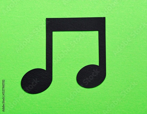 Black music note cutout on lime green background (1)