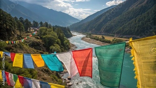 Himalayan Beauty: Vibrant prayer flags flutter against a backdrop of majestic mountains and a flowing river, capturing the essence of spiritual tranquility in a breathtaking landscape.