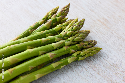 Fresh Green Asparagus on White Wooden Background