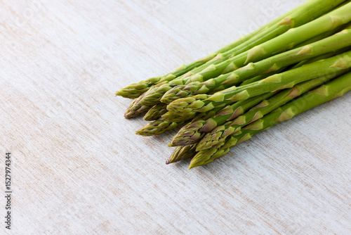 Fresh Green Asparagus on White Wooden Background