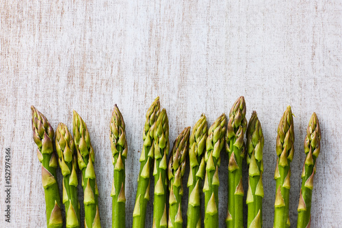 Fresh Green Asparagus on White Wooden Background