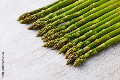 Fresh Green Asparagus on White Wooden Background