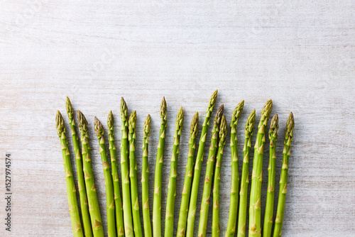 Fresh Green Asparagus on White Wooden Background