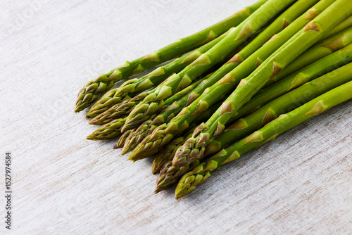 Fresh Green Asparagus on White Wooden Background