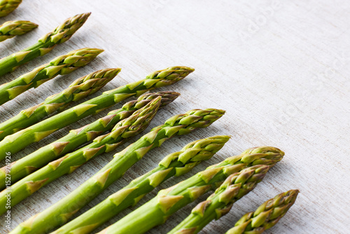 Fresh Green Asparagus on White Wooden Background