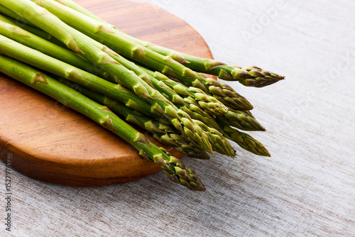 Fresh Green Asparagus on White Wooden Background