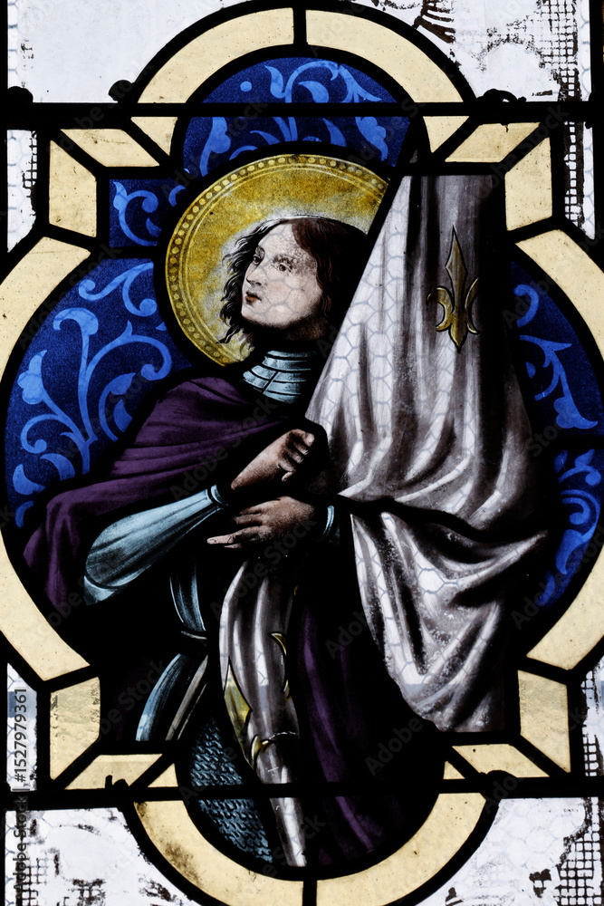 Naklejka premium Saint Marien church. Stained glass. Joan of Arc. Mezilles. France.