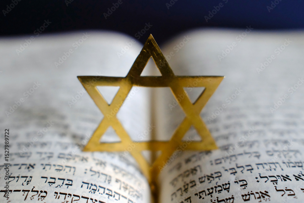Fototapeta premium Judaism. The Bible in Hebrew with a star of David.
