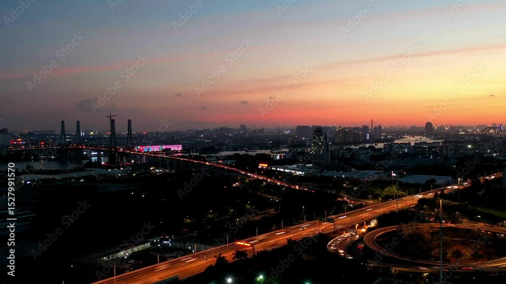 Evening sunset timelapse over Luoxi Bridge and Guangzhou city, China with moving traffic and colorful sky Evening sunset timelapse over Luoxi Bridge and Guangzhou city, China with moving traffic and colorful sky