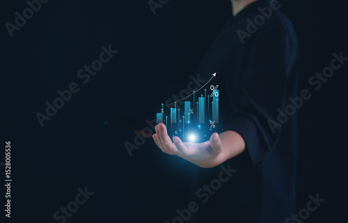 Hand holding graph with percentage, returns on investments,tax, adjusting interest rates, raising interest rates to fight inflation.