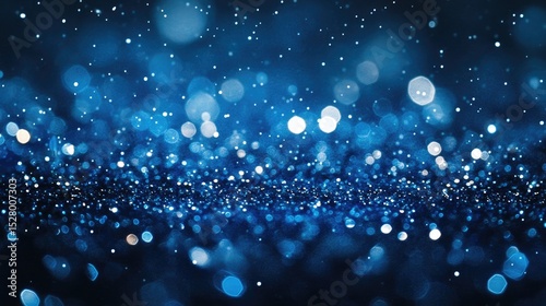 Sparkling blue bokeh background with glittering lights.