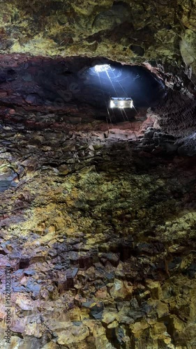 Vertical ascent of platform inside Thrihnukagigur volcano with lava rock formations.