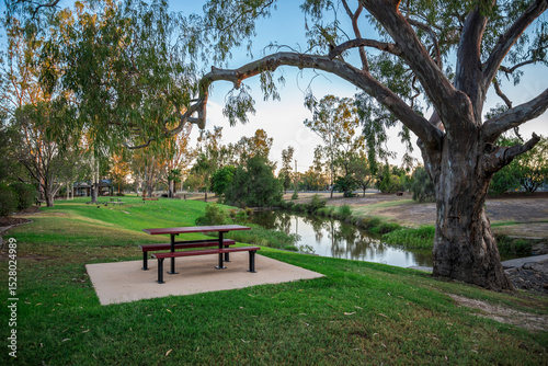 Wall Mural Scenic Park With Picnic Table Beside Bungil Creek at Sunset, Roma, Australia, 28