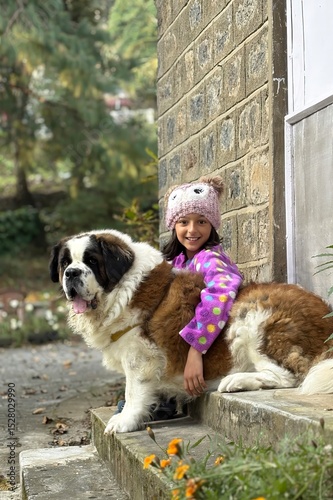 Girl with her pet Saint Bernard, Heidi