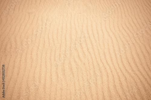 Clean yellow sand on a beach as background