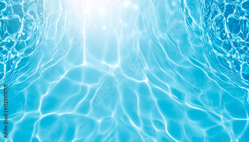 Clear blue water surface with sunlight reflections creating bright patterns, evoking refreshing and calm summer atmosphere perfect for backgrounds and designs