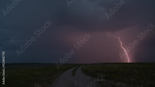 Dramatic lightning forks across stormy skies over rural hills. nature's raw power ideal for film intros, weather reports, and apocalyptic scenes.