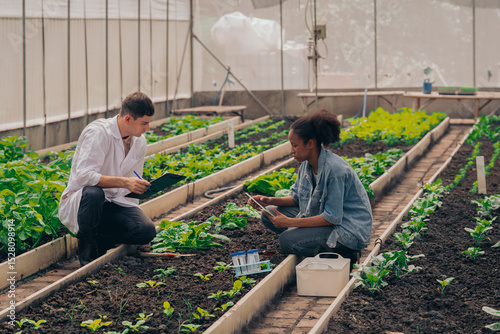 Teachers and students test and research soil for agriculture, farming, and cultivation in greenhouses.