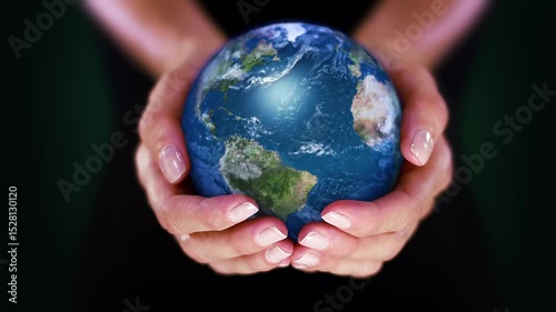 Hand Holding a Realistic Earth Planet. Environmental Conservation, Save the Planet, Ecology, Sustainable Lifestyle. World Earth Day. World globe spinning from Africa to The Americas.