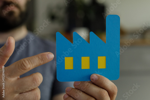Image of a man holding a pa...