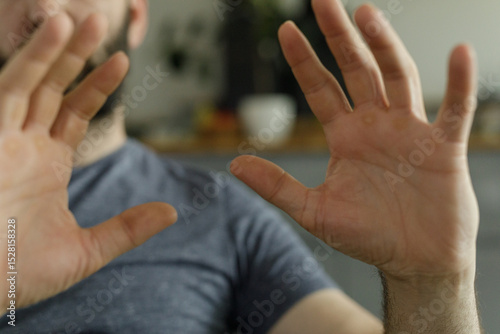 Close-up of a man's hands g...