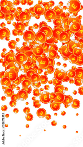 Vitamin E round capsules scattered randomly.